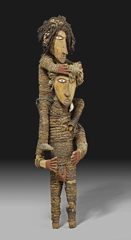 Indigenous dolls made from wood and string.