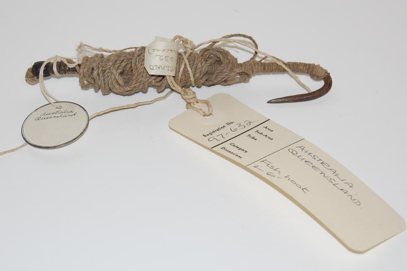 A fish hook made of iron, twine, gum and cord.
